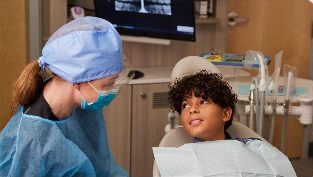 Image of a pediatric patient receiving dental care from a provider at Walmart Health